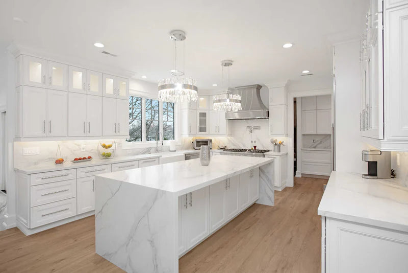 Modern white shaker kitchen cabinets with quartz countertops and stainless steel appliances - Captivating Cabinets